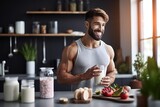 Muscular man holding glass of milk while preparing healthy breakfast in the kitchen at home.