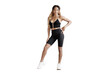 © muse studio - A full-length athletic woman in fitness clothes doing a workout for the body.  transparent background, png.