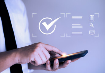 Businessman using checklist survey on smartphone, performance checklist, filling checklist digital form, taking assessment, questionnaire, evaluation, online survey, online exam.