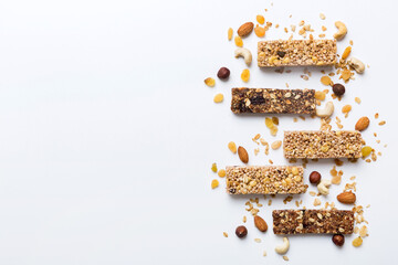 Poster - Various granola bars on table background. Cereal granola bars. Superfood breakfast bars with oats, nuts and berries, close up. Superfood concept