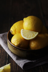 Poster - A bowl with yellow bright lemons