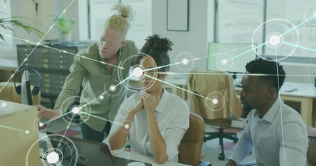 Poster - Animation of connected dots over diverse coworkers discussing reports on computer at office