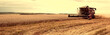 © ruslan_khismatov - Combine Harvester Working in a Field on a Farm. Seasonal Harvesting the Wheat. Agriculture. Panoramic Banner. Vintage style.