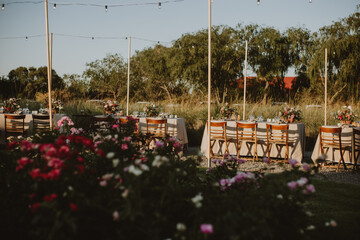 Wall Mural - outdoor wedding decoration. Table setting with flowers.