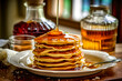 pancakes with maple syrup in home kitchen
