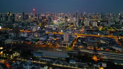 Poster - Aerial view of Bangkok Downtown skyline, highway roads or street in Thailand. Financial district and business area in smart urban city. Skyscraper and high-rise buildings at night.