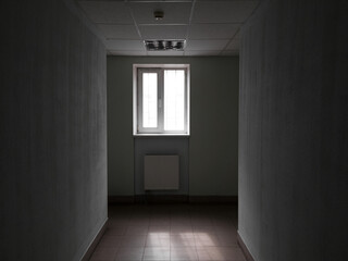 Wall Mural - empty dark office corridor with window in the end