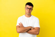 © luismolinero - Young handsome man over isolated yellow background feeling upset