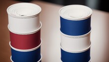 An Artful Depiction Of A Wonderful Stack Of Red, White And Blue Paper Cups