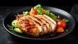 Plate with cooked chicken fillet on dark background