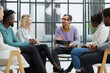 © Katsiaryna - business training and coaching in the company. people sit and chat