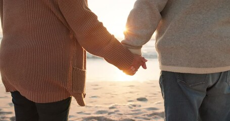 Sticker - Sunset, beach and closeup of couple holding hands by ocean for commitment, bonding and quality time for love. Marriage, travel and man and woman relax for romance on holiday, vacation and anniversary