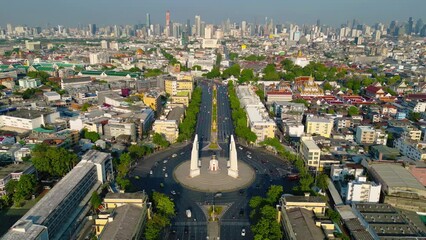 Poster - Aerial view of Democracy monument, a roundabout, with cars on busy street road in Bangkok Downtown skyline, urban city at sunset, Thailand. Landmark architecture landscape.