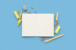 © Pixel-Shot - Blank notebook with different stationery on blue background