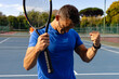 © Wavebreak Media - Caucasian male tennis player celebrating victory on outdoor court on sunny day