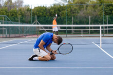 Diverse Male Tennis Players Playing Tennis And Losing Game On Outdoor Court
