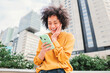 © Jose Calsina - One young adult woman using a cellphone surprised by good sales. Female watching shocked the screen of the smart phone. Successful, excited, glad, happy and amazed girl with victory face expression