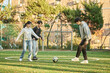 © TEAM PRE-LIGHT - Young male and female college students playing a game with a ball on the university futsal field in autumn in Asia Korea