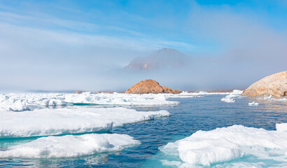 Wall Mural - arctic landscape of greenland in summer. beautiful view of mountains with snowy peaks and iceberg