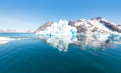 Wall Mural - arctic landscape of greenland in summer. beautiful view of mountains with snowy peaks and iceberg