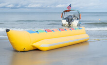 Closeup Shot Of Yellow Colored Banana Boat At The Shore Of Port Dickson Beach, Negeri Sembilan, Malaysia. 