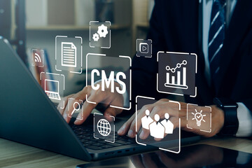 CMS - Content management system concept.Businessman using laptop to management cms software for publishing content.Blog promotion, data administration and website optimization concept.