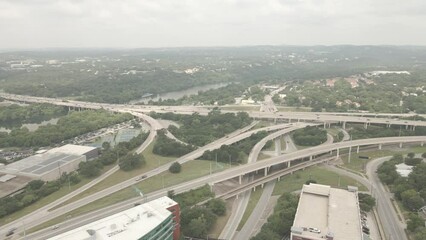 Canvas Print - Drone footage of city bridges with traffic cars with trees through buildings in Austin, Texas