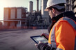 © Goffkein - Worker on an oil refinery
