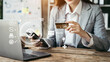 © NINENII - Woman hand holding laptop, smartphonet and using credit card for online shopping. Online shopping concept.