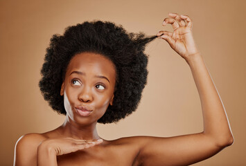 Wall Mural - Hair care, black woman and natural afro for beauty in studio isolated on a brown background. Growth, hairstyle and African female model pose with cosmetics after salon treatment for healthy wellness