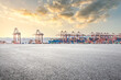 © zhao dongfang - Empty asphalt road and container port background