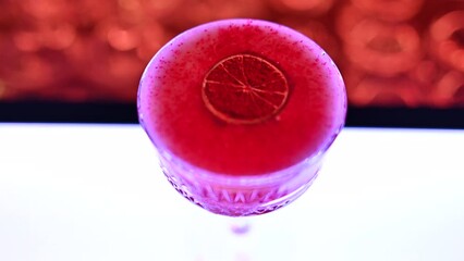 Sticker - Red sparkling white wine coctail on a glass at the bar