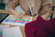 © Charlie's - Tailor woman working in tailor shop Stylish Fashion designer tailor in workshop studio designing new collection Dressmaking and Creative.fashion collection.