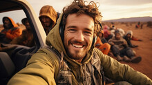 Young Man Taking Selfie In Safari Race With Group Of Friends On Background. Generative AI.