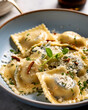 crumbly blue cheese ravioli in a white bowl, White marble kitchen table sunshine background, top down view, Close up