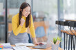 © Tj - Portrait of Asian woman using computer laptop innovative ideas, in video call conference meetings in the office.