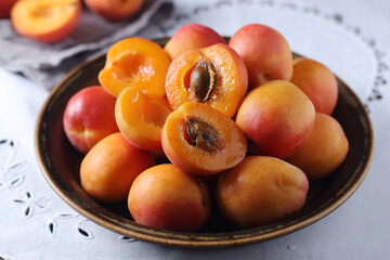 Poster - Fresh ripe apricots in bowl in rustic style