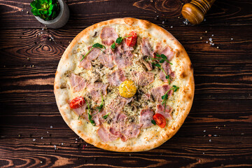 Sticker - Pizza with raw yolk, bacon, mushrooms, cheese, tomatoes, spices and microgreens, Italian cuisine.