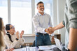© insta_photos - Happy business men executive partners making agreement with handshake at team meeting. Company investor shaking hand of customer, client making successful trade merger international deal in office.