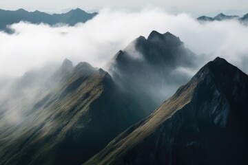 Wall Mural - mountain range with thick clouds and mist, providing a serene setting, created with generative ai