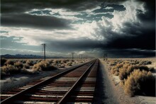 A Train Track In The Middle Of A Desert With A Sky Full Of Clouds Above It And A Telephone Pole In The Foreground With A Telephone Pole In The Foreground And A Distant.