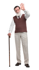 Wall Mural - Senior man with walking cane waving on white background