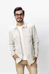 Wall Mural - Man fashion portrait in glasses smile with teeth joy on a white isolated background, trendy clothing style, copy space, space for text