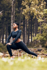 Canvas Print - Stretching, fitness and black woman lunge in nature for exercise, training and sports in forest. Hiking, mountain and female person stretch legs for warm up, workout and wellness for performance