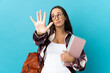© luismolinero - Young student woman over isolated background counting five with fingers