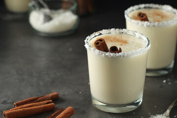 Two glasses with traditional Puerto Rico cocktail Coquito	