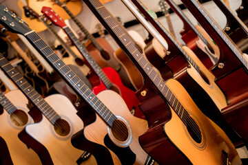 Wall Mural - Many rows of classical guitars in the music shop