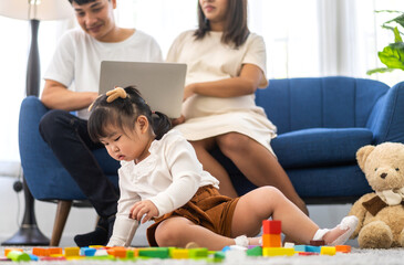 Wall Mural - Portrait of enjoy happy love asian family father and mother with little asian girl smiling activity learn and skill brain play toy build wooden block board education game, children development at home