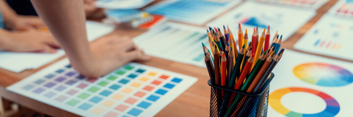 Aufkleber - Graphic designer brainstorm logo and graphic art at busy creative studio workshop. Experiment and brainstorm color palette and pattern at workspace table for creative design. Panorama shot. Scrutinize