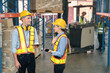 © Dearix - Caucasian man, woman warehouse supervisor discuss and use tablet check package with forklift driver worker load box on shelf, product distribution inventory management,Logistics shipping business plan